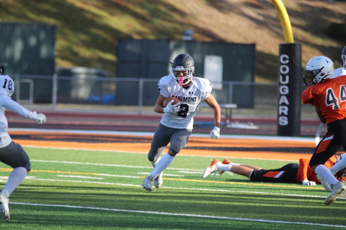 Carlmont sophomore Austin Sotto drives forward with determination, with his eyes set on the path ahead. 