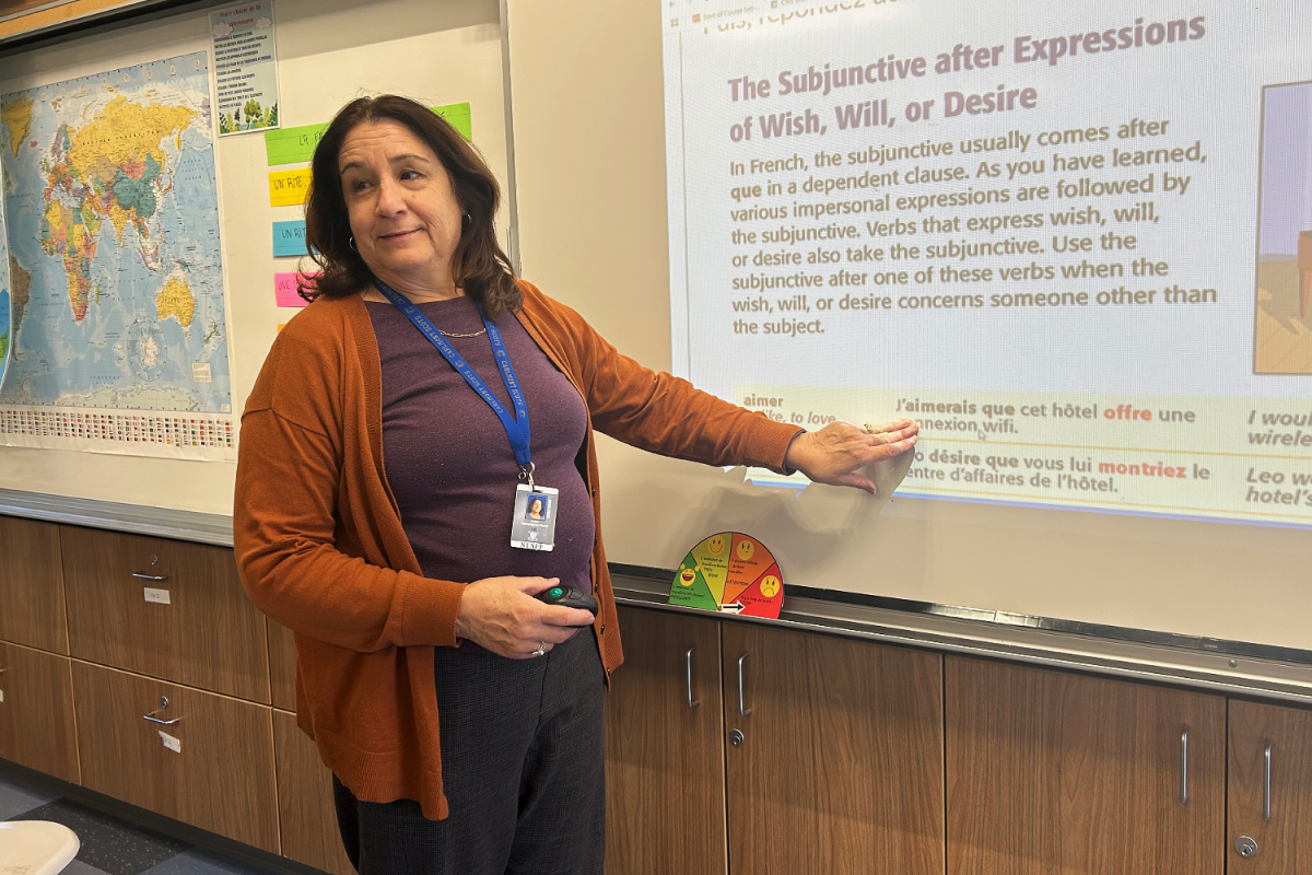 Anne Campagnet Reed explains the subjunctive to the class. "I like it when my students broaden their horizons and become aware of other cultures and see how similar we are as humans," Campagnet said.