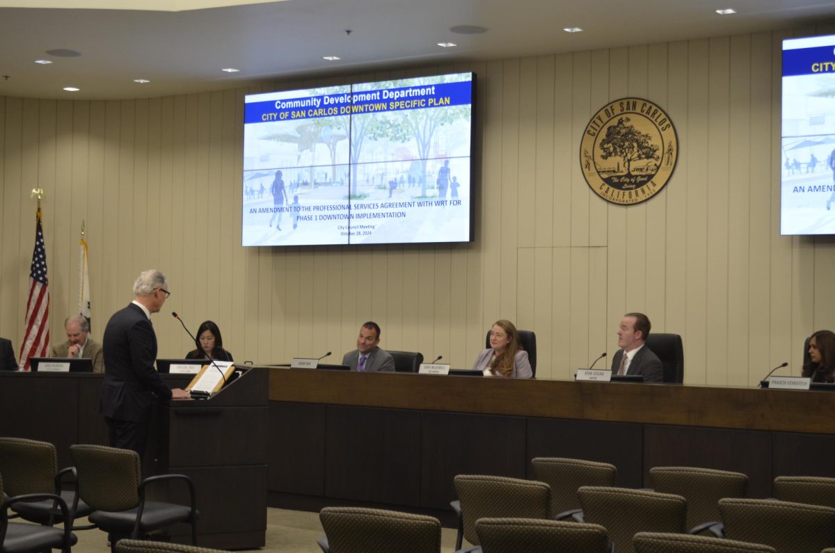 The San Carlos City Council discusses an aspect of their Downtown Specific Plan with a member of the Community Development Department, which is one of the many ways the council members drive change in the city.