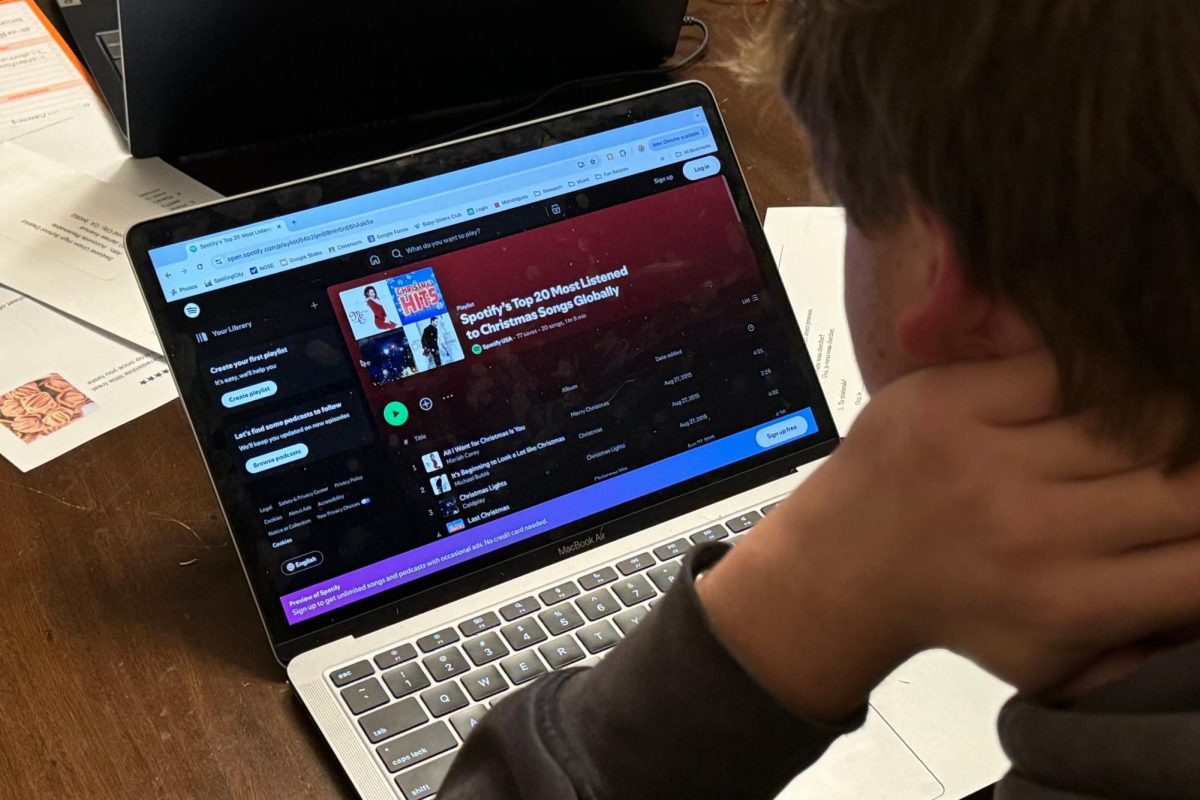 Daniel Behrendt, a Carlmont senior, looks at Spotify's Top 20 Most Listened To Christmas Song Globally. "I think Christmas music should start being played in late November," Behrendt said.