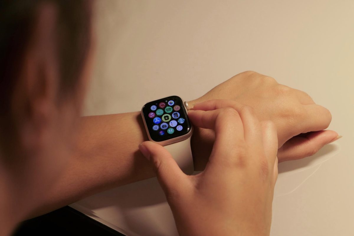 A person navigates their smartwatch, utilizing its different functions. The use of such devices in classrooms has become a debate among teachers and students of whether or not they are a diversion to students’ learning.