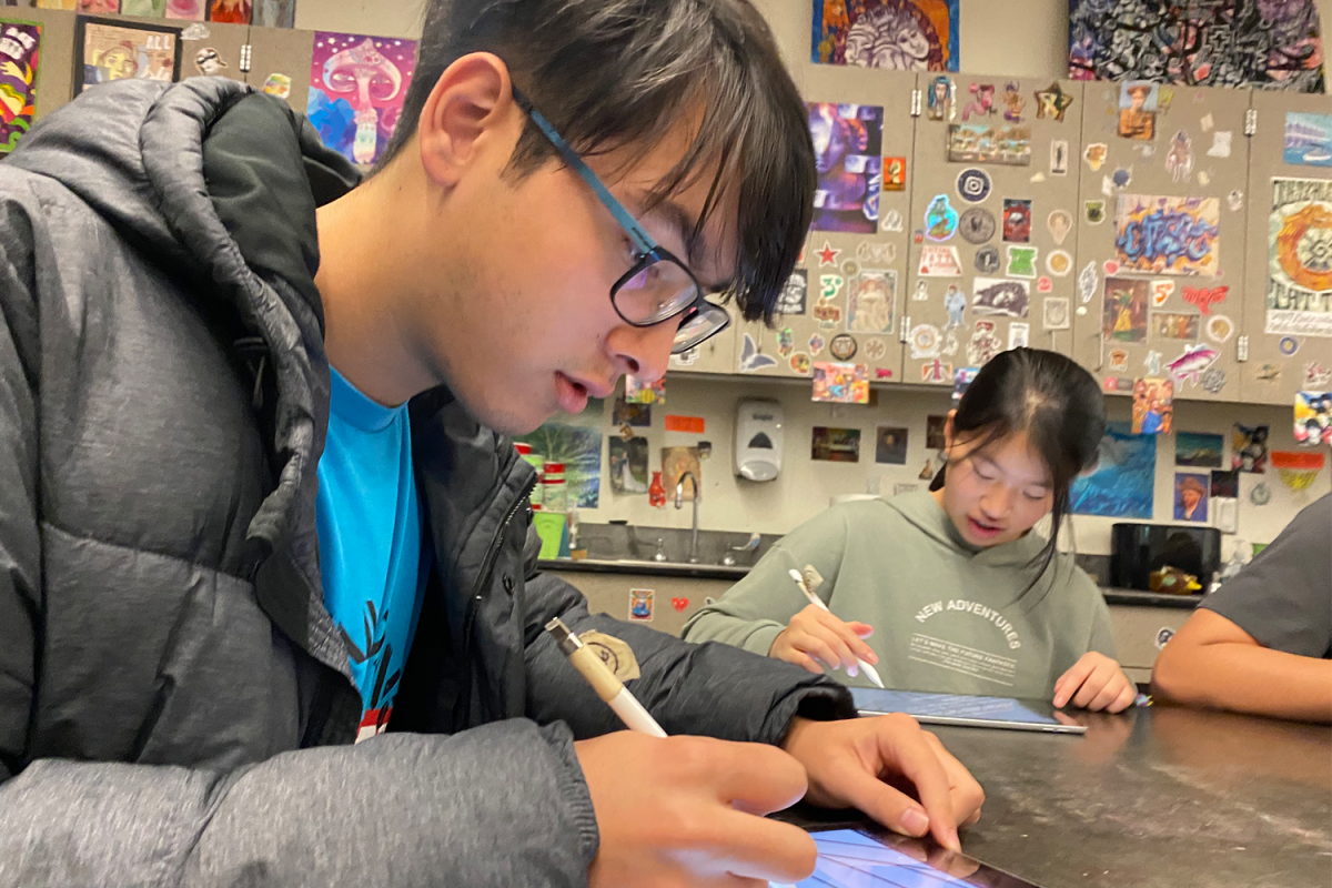 Art club members use school-issued equipment to work on their latest project in Schulman's highly decorated art classroom. They seek inspirations for their art pieces in each other, the classroom, and the world around them. 