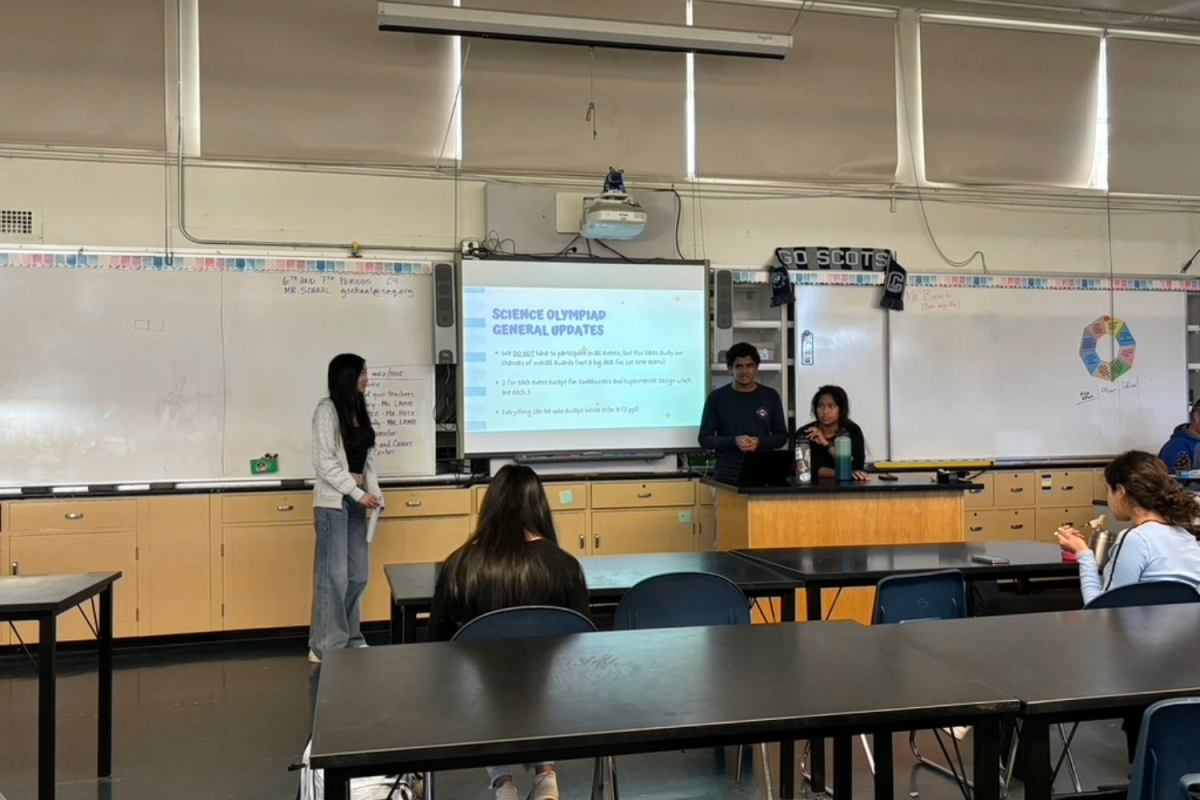 Charlene Xu, Nikhil Nunna, and Sumehra Esguerra, all sophomores at Carlmont, present to other club members about their upcoming February Science Olympiad. Through weekly meetings, the club aims to be adequately prepared for various challenges at the science, technology, engineering, and mathematics (STEM) event.