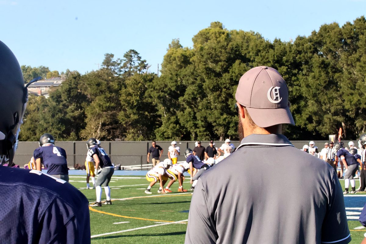 Coach Dario Navarra watches his players line up to run a play against Ukiah high school. The Carlmont JV football team won this game 29-21. Navarra played a crucial role in helping the team to an 8-2 season.  