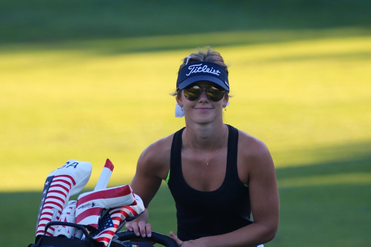 Molholm happily walks off the course. After a long round she was happy to be done. She continued to cheer on her teammates as they finished their rounds. 