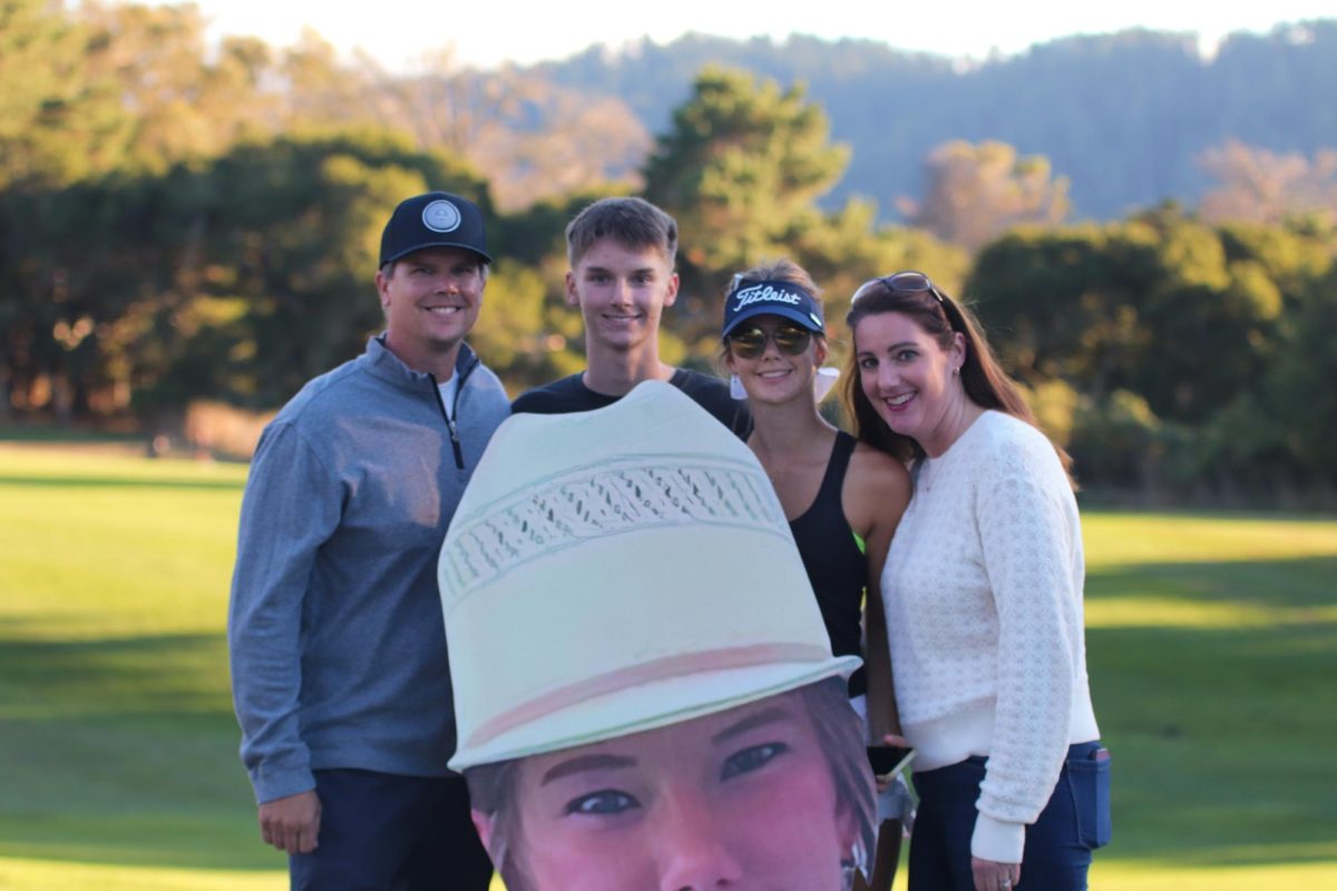 Molholm celebrates with her family on her senior night. Molholm has been playing on the team since she was a freshman. It is a Carlmont tradition to recognize the seniors in their last home match to congratulate them on their achievements.