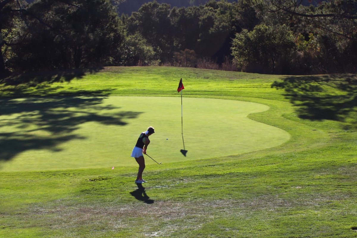 Molholm makes a chip along the green. These shots are crucial in golf because they can make or break your round. Molholm converted on a lot of chips to help keep her score low.