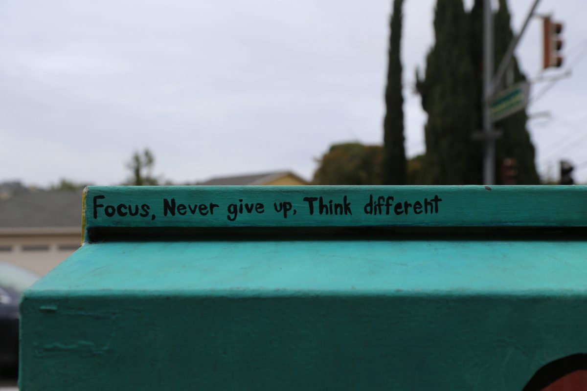 A saying from the local children is hidden on the side facing away from the street. “It was my last day of painting and a man who lives nearby came. He said all the kids who live in this condo area have their own community and they have watched me paint the box and feel connected to it. They have their own phrase, and I forget what the phrase is, but he asked me to paint their phrase on the back of the box so you can see it there," said Lee.