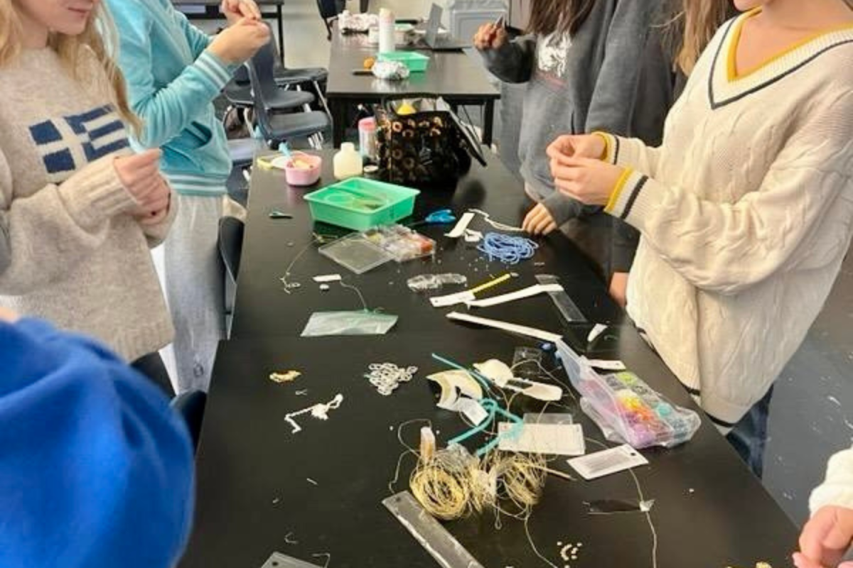 Club members make earrings using can tabs and other recycled materials. "People love jewelry, so we intend to make a lot of it to sell," said Ocean Studio Vice President Claudia Williams. This and other art projects will go towards spreading awareness of current marine and climate issues, and eventually they hope to sell their creations to go towards conservation efforts.