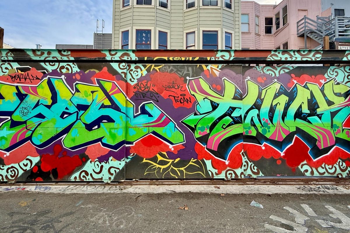 San Francisco's Clarion Alley features a wildstyle graffiti piece, characterized by vibrant colors and extremely exaggerated, overlapping, and intertwining letters. 