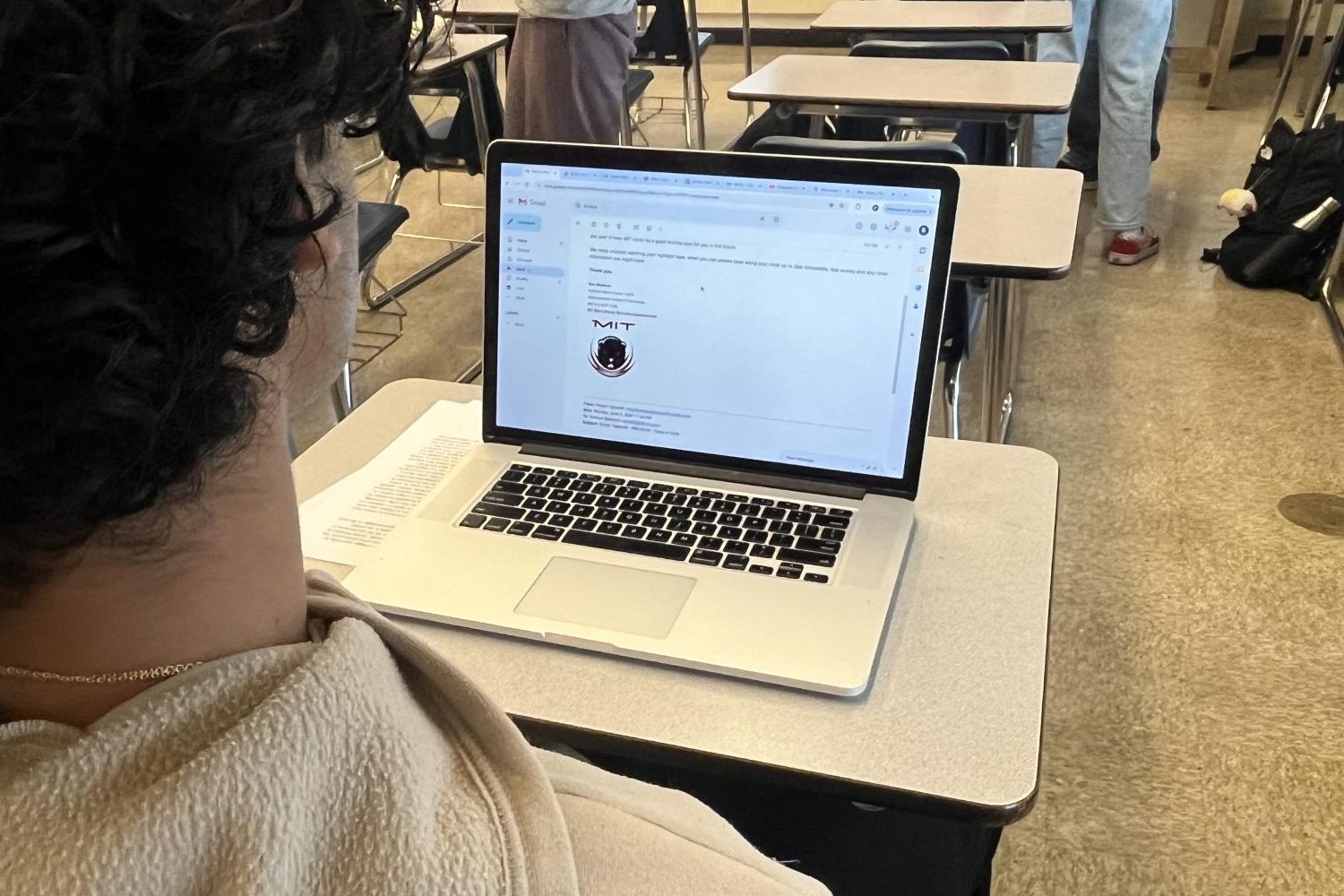 Junior Rohan Yadavalli checks his email, reading through messages from college coaches. In the process of recruitment, constant communication with coaches is key.