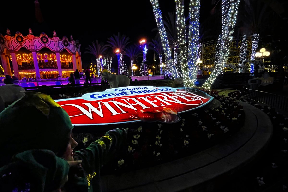 The California's Great America WinterFest sign welcomes visitors as they enter the park. "My favorite part of WinterFest is the lights. I get super happy, and it's one of my favorite parts about Christmas in general. All the lights and decorations are so much fun," said Kennedy Staggs, a sophomore at Carlmont.