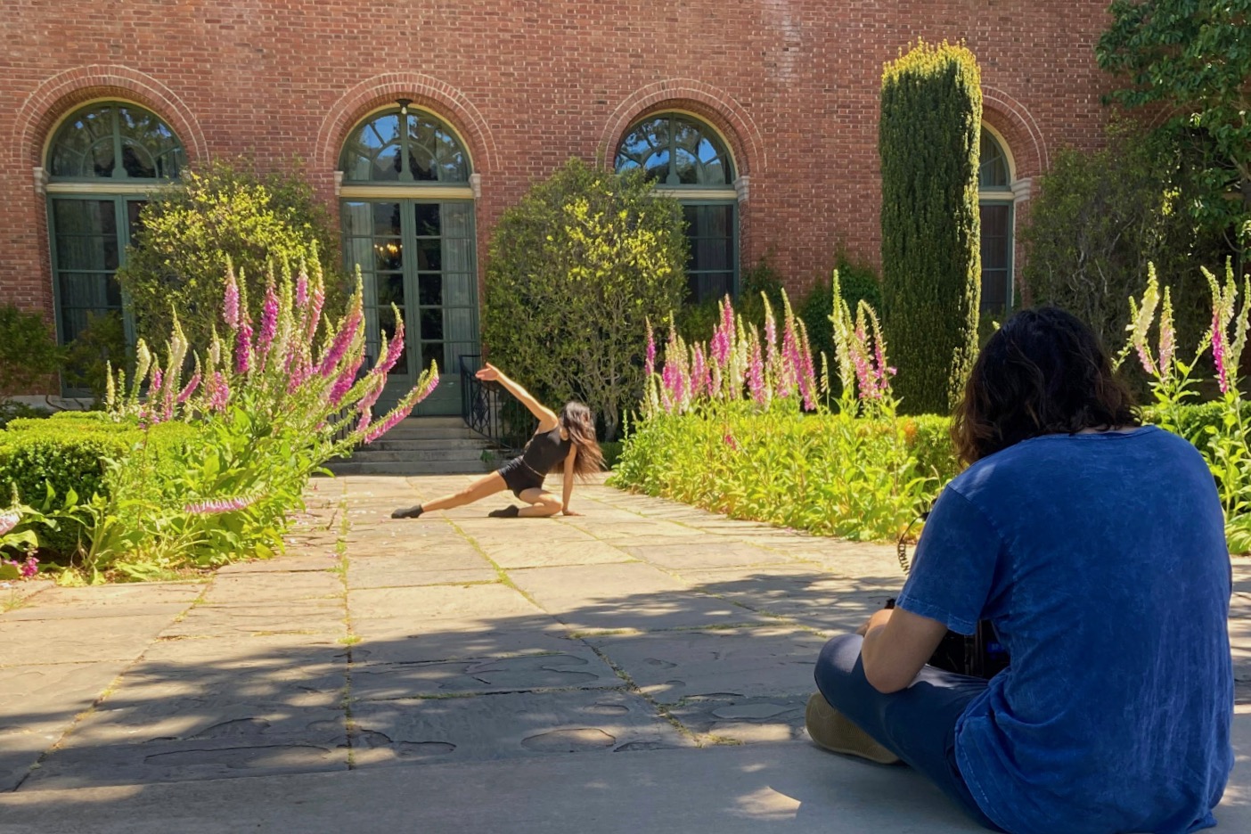 A dance student is recorded performing choreography in front of the Filoli Historic House in Woodside, Calif., for a film piece directed by her teacher. Jobs in dance can vary, ranging from performances to choreographing to music videos. Videos are an integral part of sharing choreographic works with the dance community and aid in building connections.