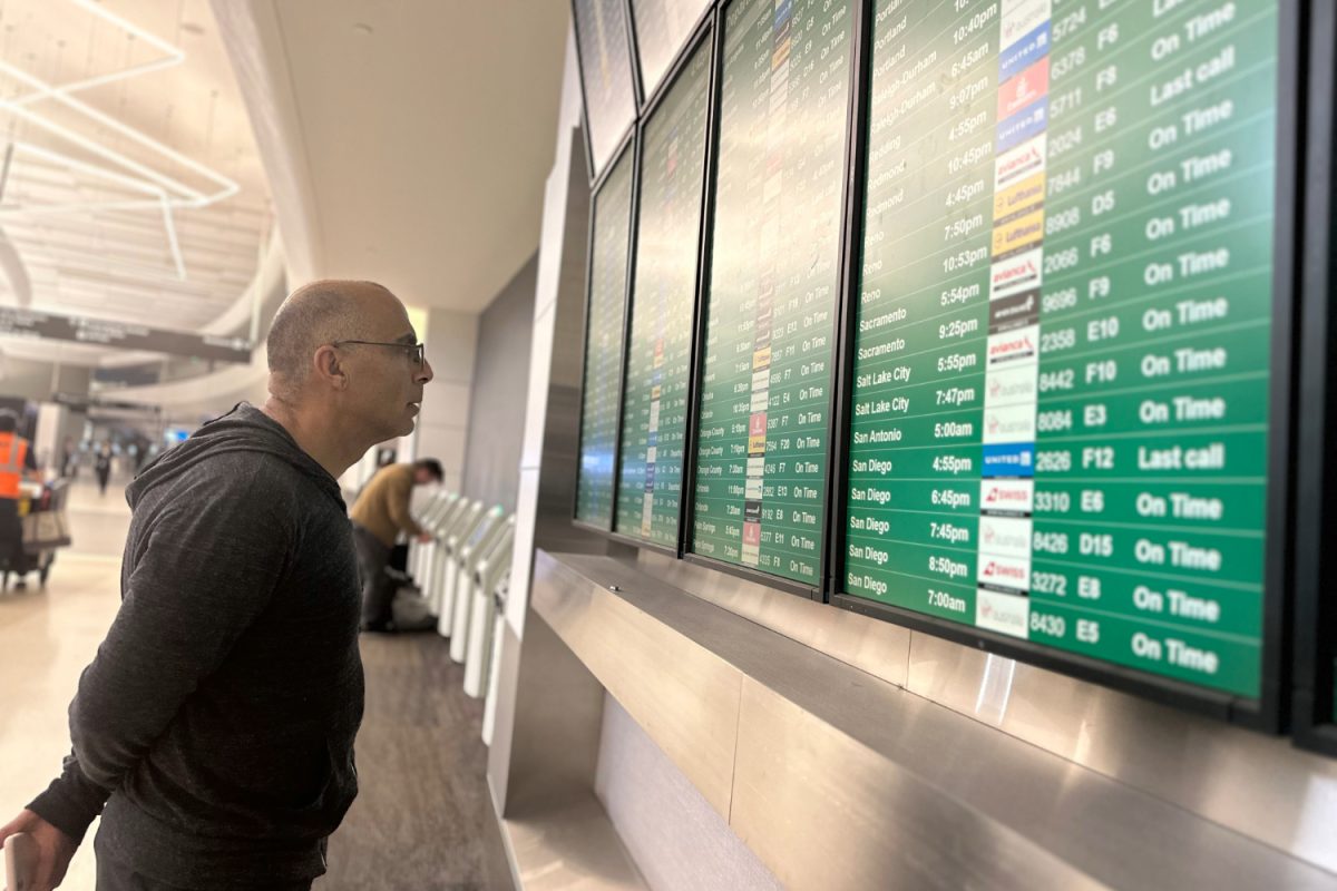 A traveler checks the status of his flight at the San Francisco International Airport (SFO). According to InsureMyTrip, SFO has the highest flight delay percentage out of all United States airports. As of January 2024, 37.2% of all SFO flights have been delayed.