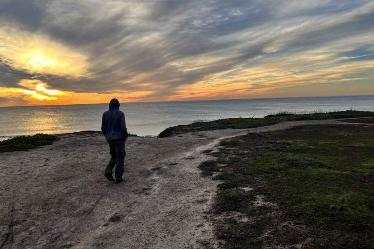 Carlmont student Chase Daru walks along a trail in Half Moon Bay. Due to the change in agriculture, it can be seen the amount of times people have gone off or overused the trail to expand it and make it look destroyed.