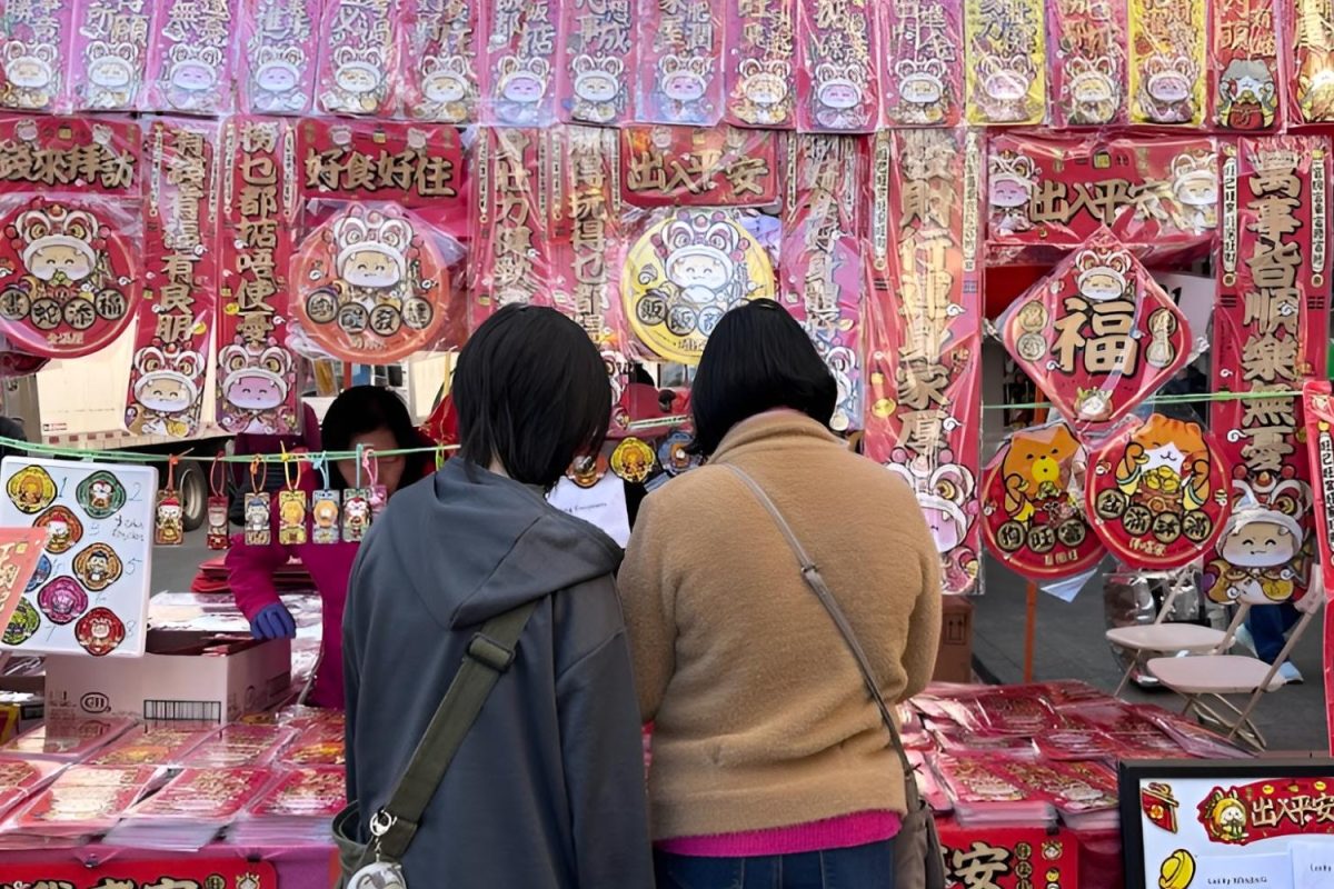 A family looks through the various red envelopes to give out for the Lunar New Year bringing good luck and prosperity. Each of them are decorated snake themed designs for the Year of the Snake.