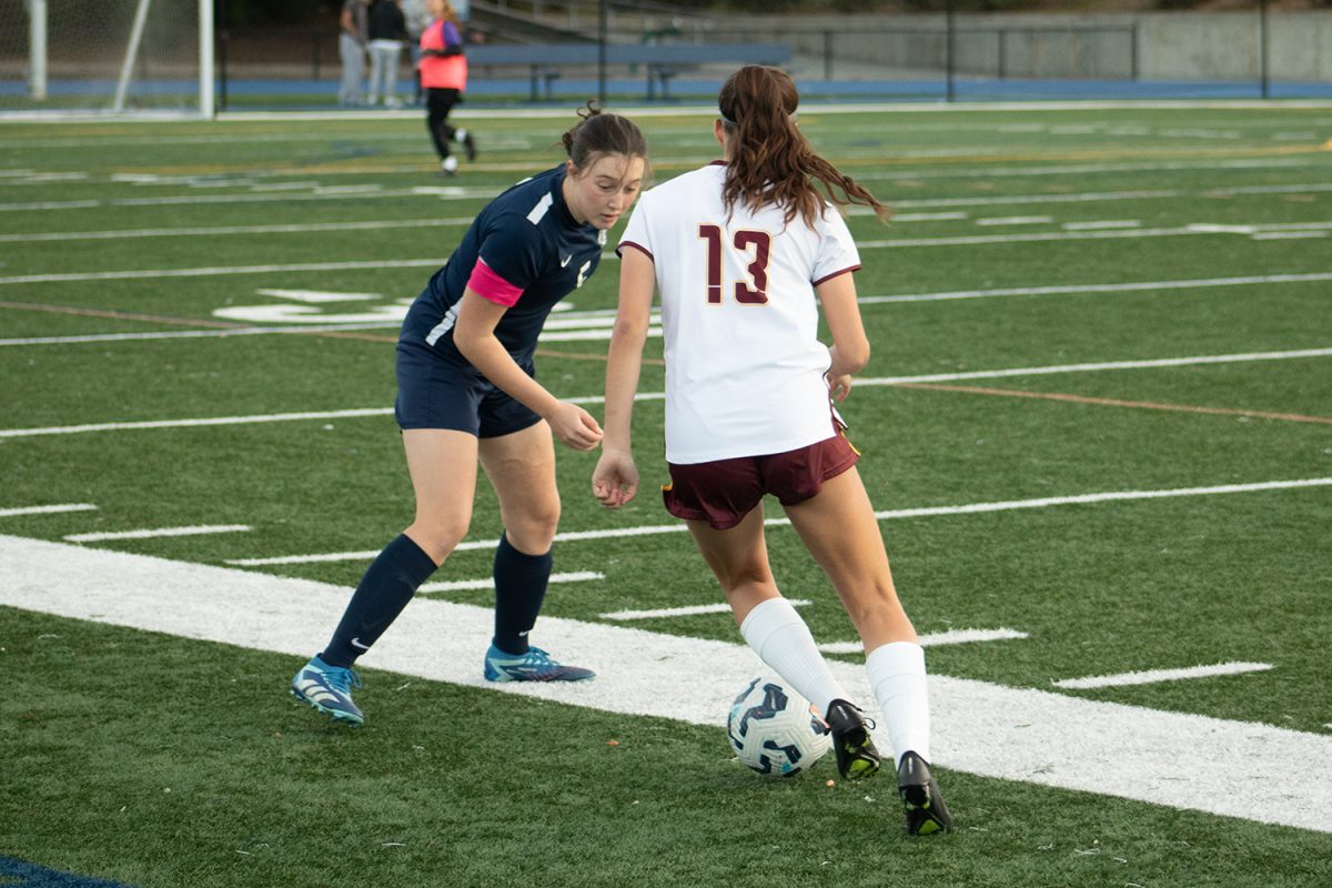 Scots defender Callie Hernandez faces a Bears attacker. Hernandez was the Scots' captain during the game, so her role as a leader was important on the field. She was able to close down the attacker and win the ball.