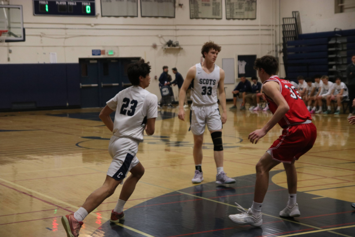 Jordan Rice, who is a sophomore on the varsity boys basketball team, makes a move to create open space on the court to give his team better scoring opportunities.