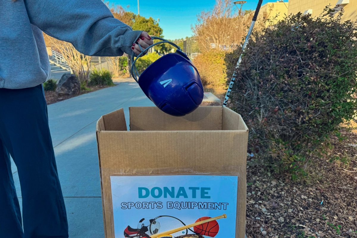 A Carlmont student places a helmet into the Equipment drive bin on Campus. The drive is accepting gently used or new equipment for underprivileged youth. “It is so rewarding to feel like you're actually making a difference in others lives," said Mateo Golomb. 