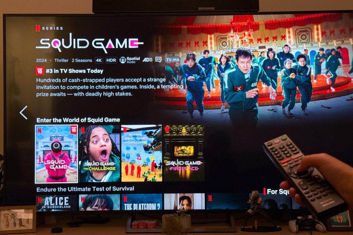 A viewer selects the second season of "Squid Game" to watch within Netflix's Squid Game Collection. The highly-anticipated second season has dominated Netflix's Top 10 charts since its release on Dec. 26. "Season 2 is a lot more unpredictable than Season 1," said Katelyn Yee, a sophomore at Carlmont. "Unlike the first season, you can't really tell who's going to die and who's going to survive."