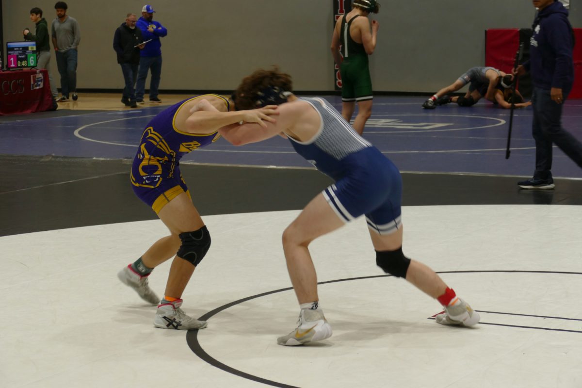 Junior Camilo Barberena squares up with Santa Clara wrestler in the second Championship round. Barberena ended up winning this match 15-3 by major decision. 