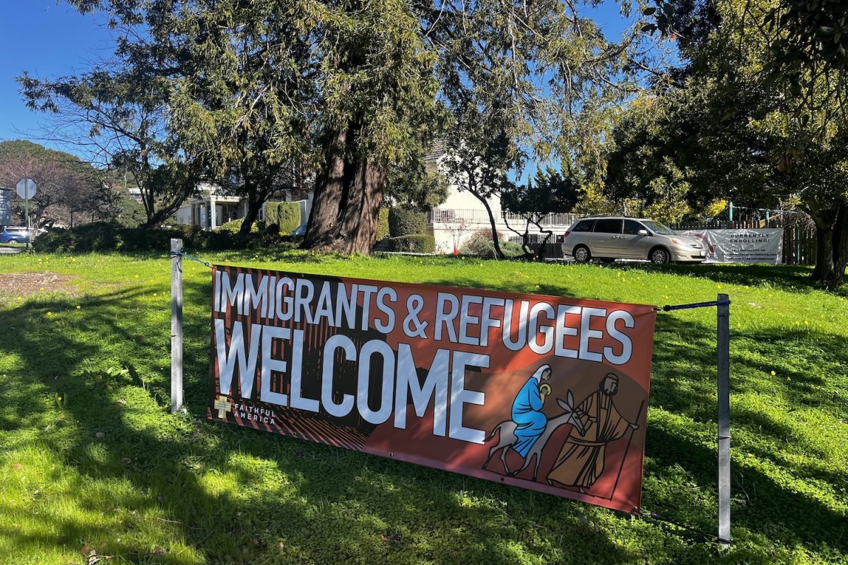 The Congregational Church of the Peninsula (CCP) displays a banner that welcoming of immigrants and refugees. 