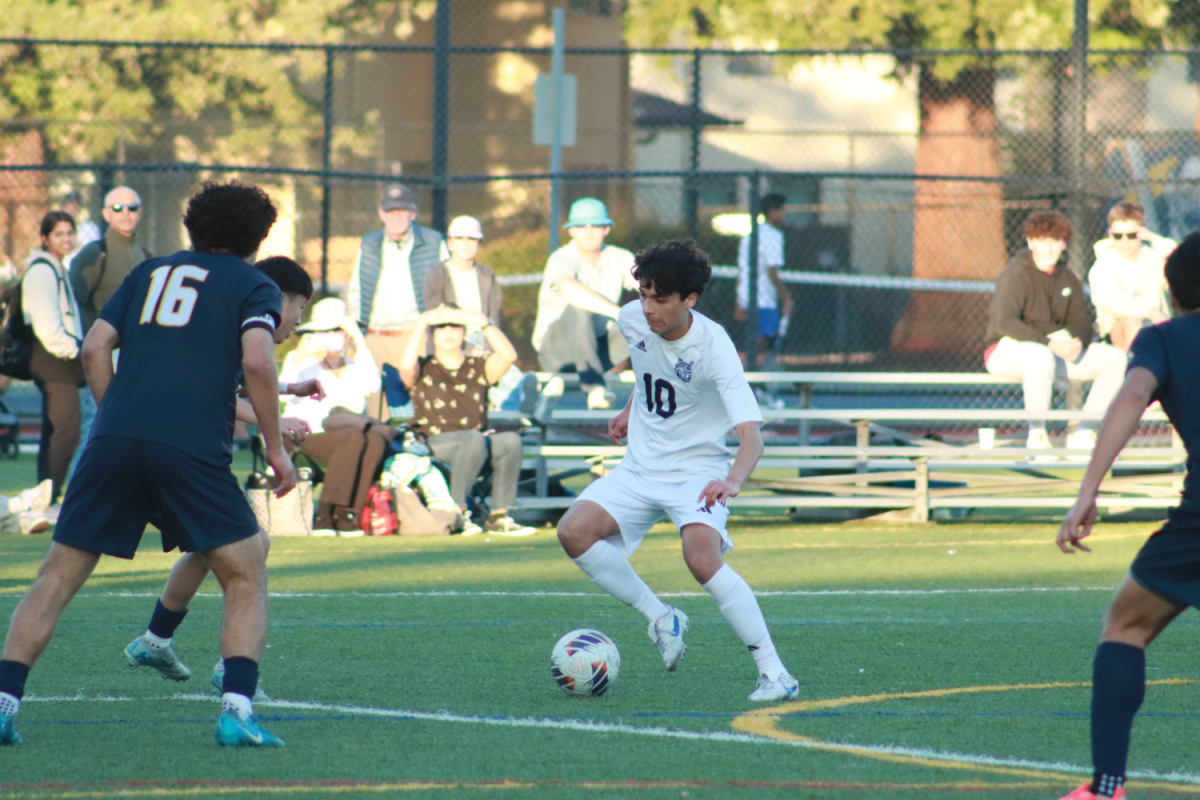 Senior striker Hudson Gates takes on a defender. This was a good choice in the heat of a game. The play kept defenders on their toes and taught them to be ready for anything against the Scots.