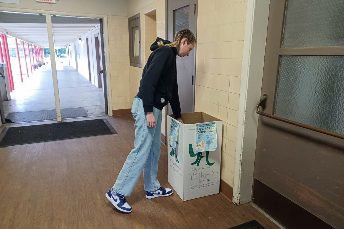 A member of the Belmont community reaches into the Hygiene Drive collection bin to make a donation. Bins such as this one sit in community centers around the city, where passersby might see them and contribute. Edward Kogan, the president of the Youth Advisory Committee, speaks about what they are looking for. "We accept unused and unopened hygiene items. So it’s anything that a customer should keep hygienic such as deodorant, toothpaste and toothbrushes," Kogan said.