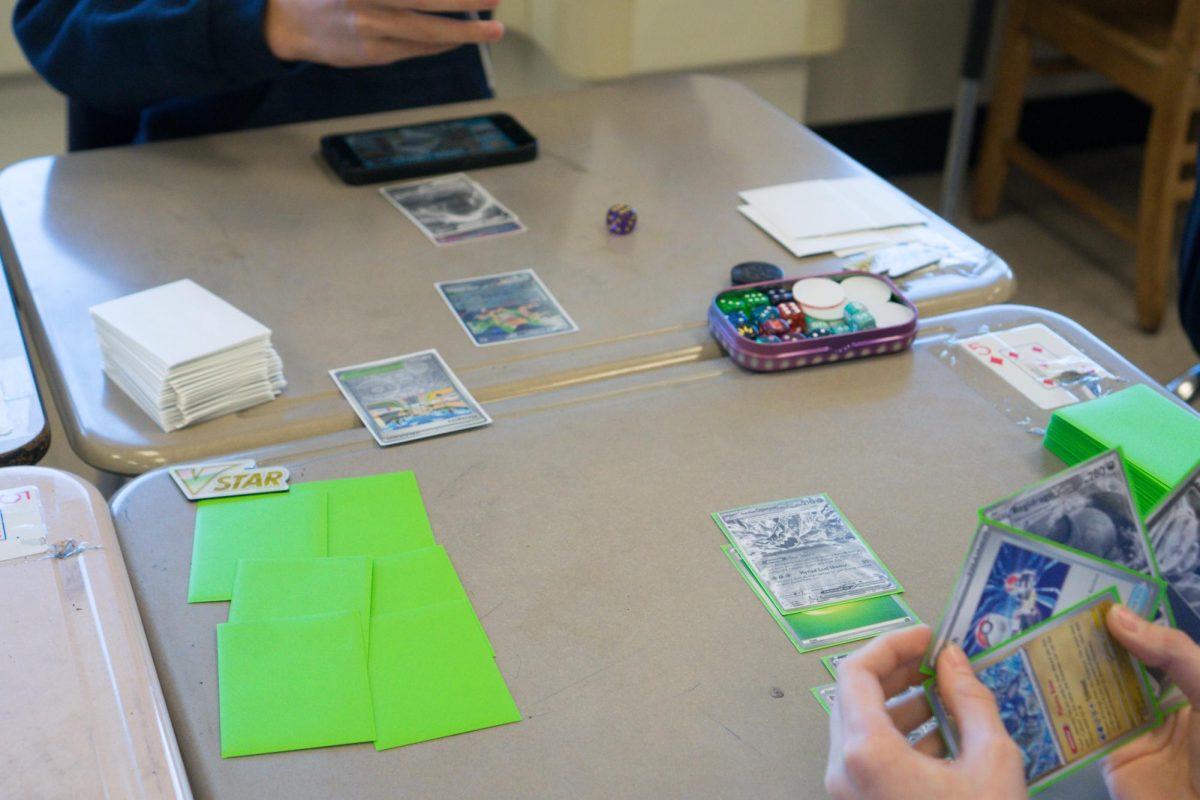 Ethan Yao and Grant Ashcraft battle with their Pokémon cards during lunch at the Pokémon club. The Pokémon Trading Card Game (TCG) has become increasingly popular, and many players will spend lots of time and money building strong decks to battle with. 