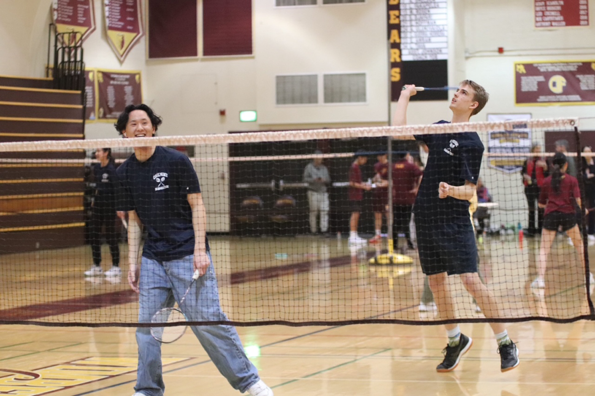 Carlmont senior James Farquharson jumps up to hit an attacking clear shot. He was in the boys doubles partnered with senior Colin Tsai. They won both matches, the first came to 21-5 while the second ended at 21-7. 