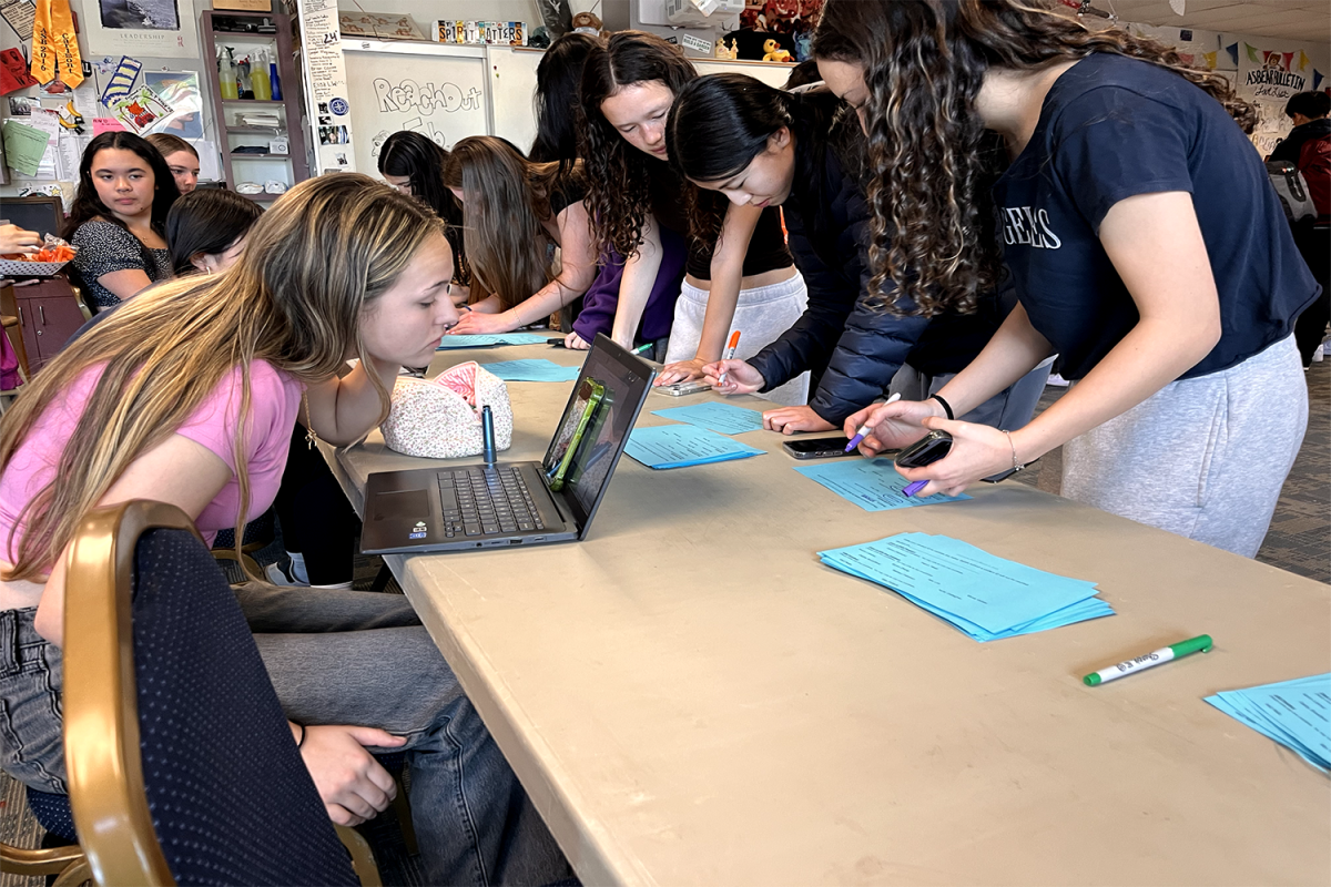 Carlmont students vote for who they want to be ASB president. Students write out their vote on a piece of paper and place them in a drop box to be counted.