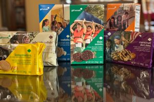 Several different Girl Scout Cookies line up next to each other. In recent years, Girl Scouts has had many Girl Scout Cookie-flavored items throughout large grocery store chains.