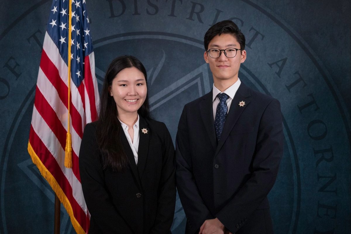 Sophia Park commemorates becoming a prosecutor at the office of Tulare County's district attorney by posing alongside her brother, Peter Park. Besting her brother by three months, she is the youngest person to pass the California State Bar Exam.