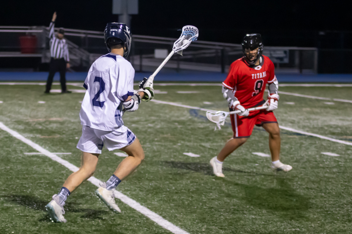 Carlmont senior James Mauck stares down his defender as he decides which direction to go in. Mauck had two goals, one in the second and another in the fourth quarter. The Scots offense was efficient throughout the game, with 6 goals in the third quarter alone. 