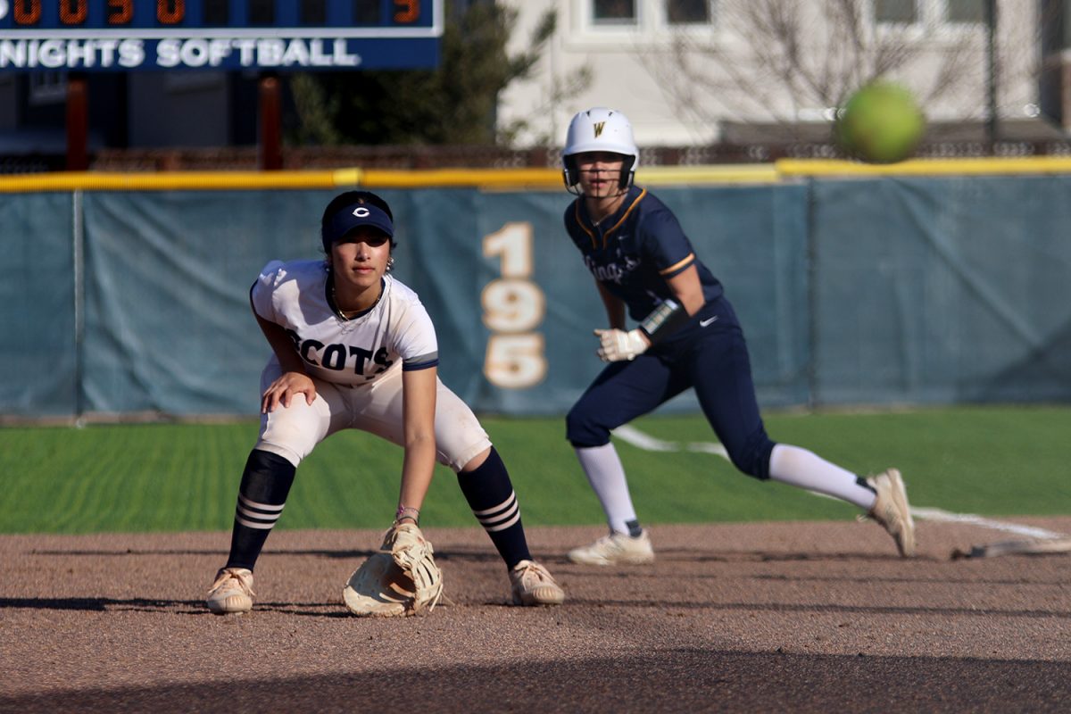 Fung focuses on the ball as the pitch goes toward the batter. Her positioning depended on both the batter and the runner on first base. Fung played both first base and pitcher during the game. 