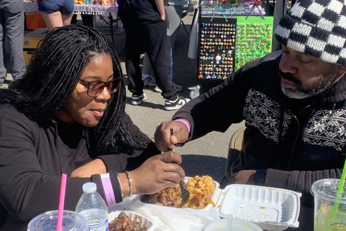 Foodie Fest visitor Channing Jackson enjoys a hot meal with her family before leaving the event. Like many others, Jackson saw flyers on social media and decided to check the event out. "Supporting small businesses and entrepreneurship is so important to our family," Jackson said.