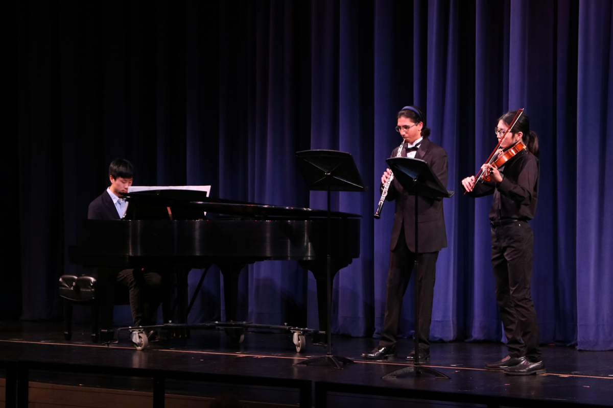 Juniors Arthur Li, Vincent Wong, and Akhil Pillai play a self-composed song called "Celestial Exploration." The group has performed self-composed pieces since they got together. "At the start, in ninth grade, it was just out of curiosity, a way to experiment with something new," Li said.