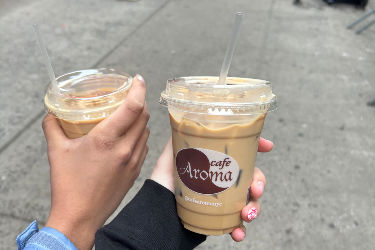 Seniors Siena Farrell and Tessa Brown grab a latte from Cafe Aroma before venturing around New York City. Cafe Aroma has a vast selection of beverages and pastries to choose from.