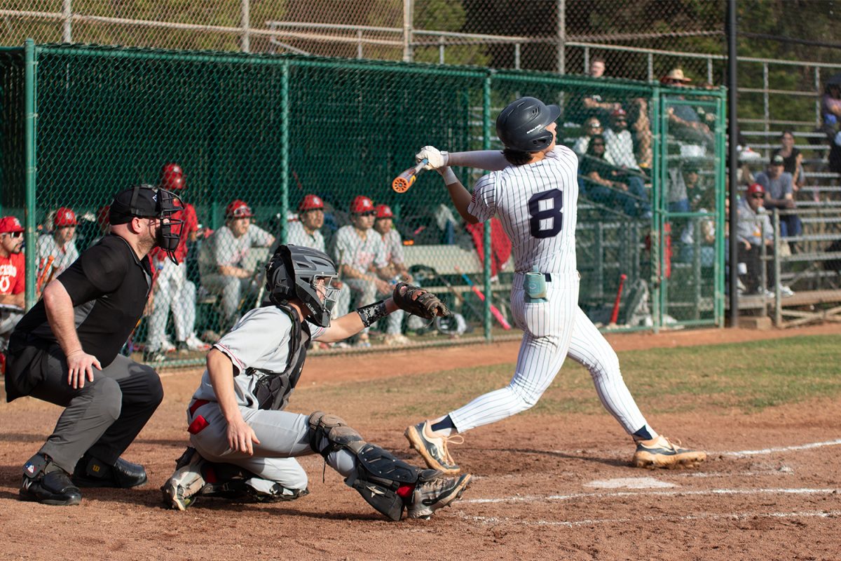 Senior Zach Luzzo drives a ball to left field in Carlmont’s win over El Camino. “I think just being more aggressive is the key to success,” Luzzo said. “Staying aggressive and confident will help us trust ourselves.”