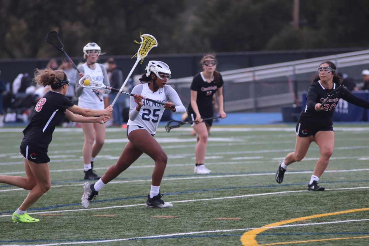 Junior captain Dani Lewis weaves through multiple defender to create a chance to shoot. Lewis plays a pivotal role as the captain as she has to lead the team throughout the game. She provided multiple of the Scots' 13 goals in this match. 