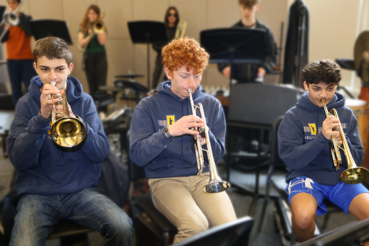 Carlmont trumpet players warm up before class. They have been playing their instruments since middle school.