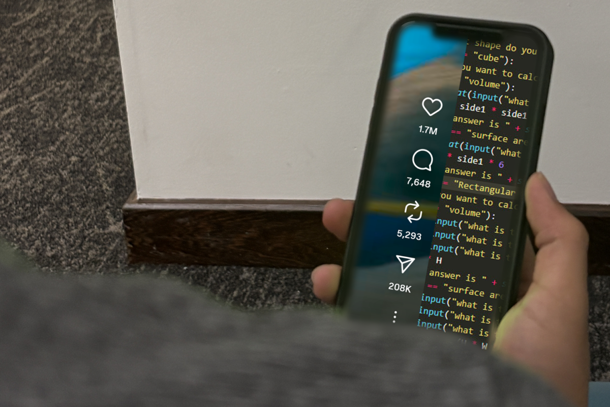 A person holds a phone with statistics for a video on one side and code on the other, symbolizing how social media algorithms influence the success of a video. “I just post whatever I want, and if it does well, it does well,” said Declan Lai, a Carlmont student.