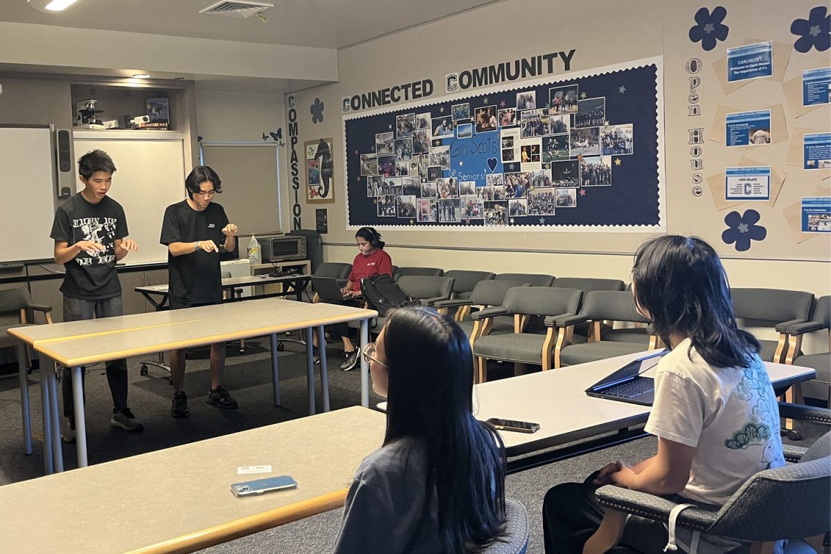 Cody Ng and Kellen Kato rehearse their duo interpretation speech during practice so they can receive feedback. In this event, two speakers act out a literary scene without props and actively convey emotion and depth.