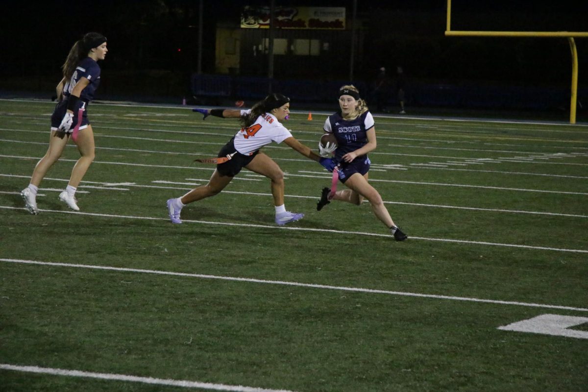 Athena Dogadkin, Carlmont's linebacker and wide receiver catches a pass from California's quarterback and runs down the field attempting to score a touchdown. Dogadkin successfully made it past California's defender though she was unsuccessful in scoring the touchdown. "I was running down the field as fast as possible," Dogadkin said. 