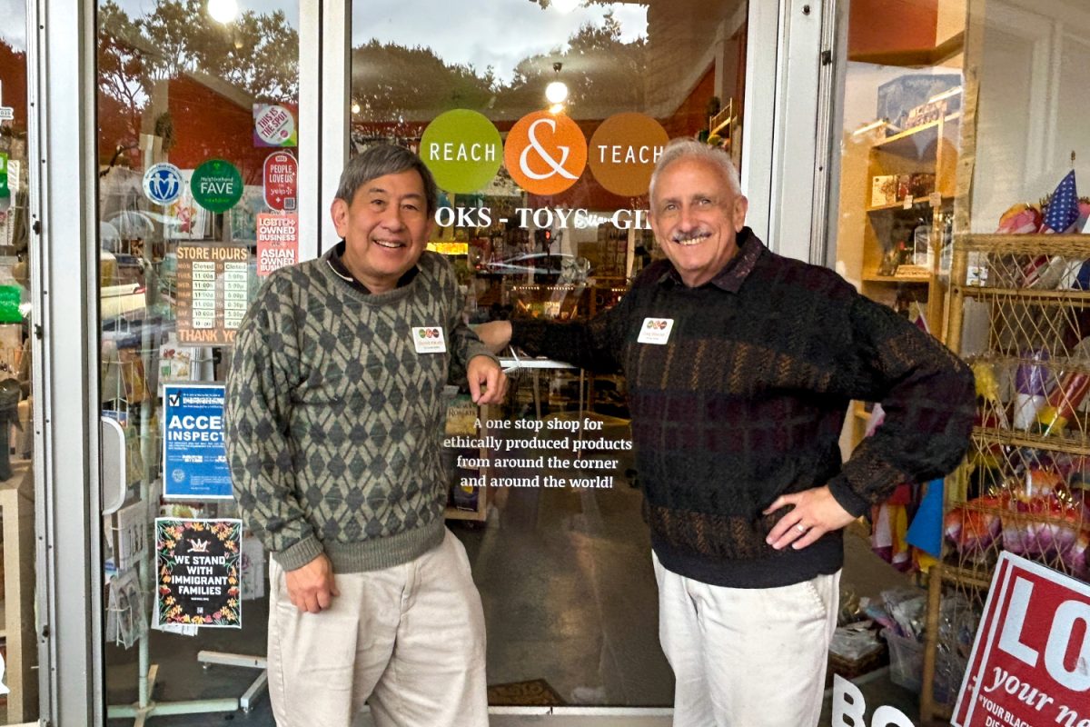 The owners of Read and Teach, Derrick Kikuchi and Craig Wiesner, stand together in front of their store. "I hope that folks will take a chance and come visit our shop and see what we have to offer. And we think they'll see something that shines for them, something that reflects them, when they come in," Wiesner said. 