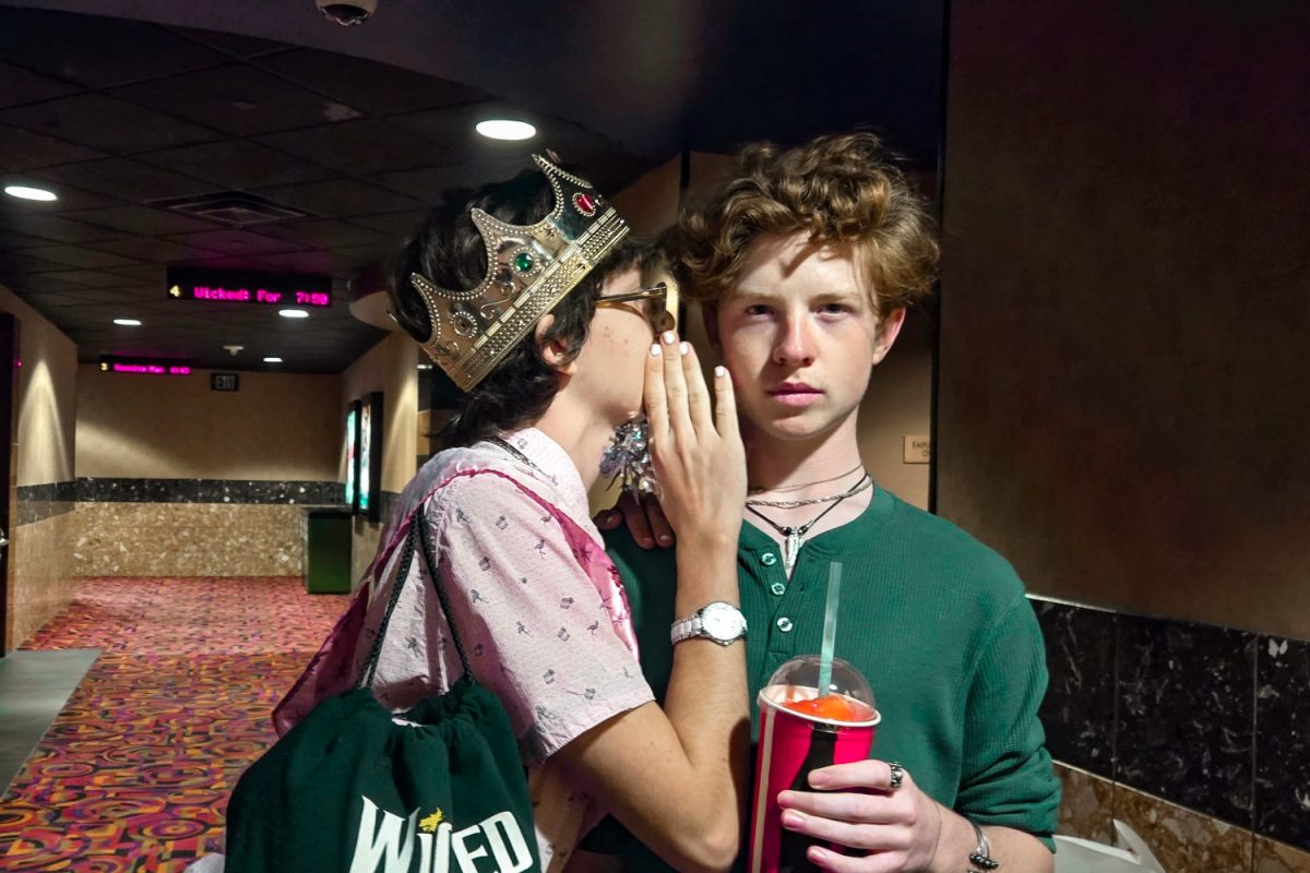 Carlmont students Lucas Papa and Nathan Conley mimic the iconic pose from the original Broadway "Wicked" album cover. While seeing "Wicked: For Good," they dressed up in the franchise's featured colors of pink and green. "I chose an outfit inspired heavily by Glinda because it helped me have fun watching the movie," Papa said.