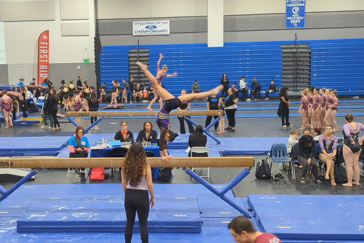 Sophomore Hailey Dao competes at the CIF Southern Section Championships in the Xcel Diamond level. Dao executed her skills at the high bar as multiple judges watched. "Hailey is very good and consistent at vault and bar," said teammate Ella Ding.