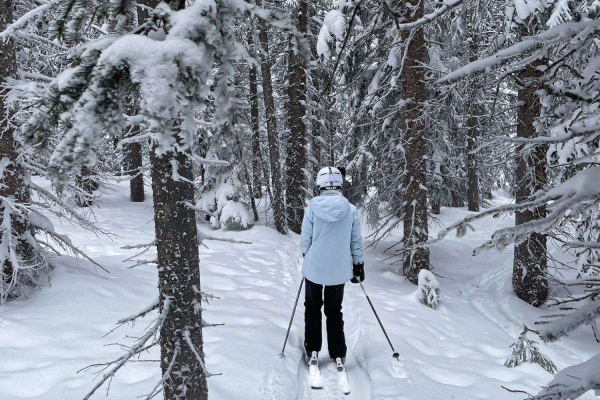 Evelyn Ricci skies between the trees on a fresh powder day, following closely behind her cousin. After it snows, the mountains truly start to feel like a winter wonderland; the trees are dusted with snow, and the atmosphere takes on a new quality. “I just really enjoy going skiing with my cousins and my family, but I like the times when it snows a lot, and there's a lot of powder on the mountains,” Ricci said. 
