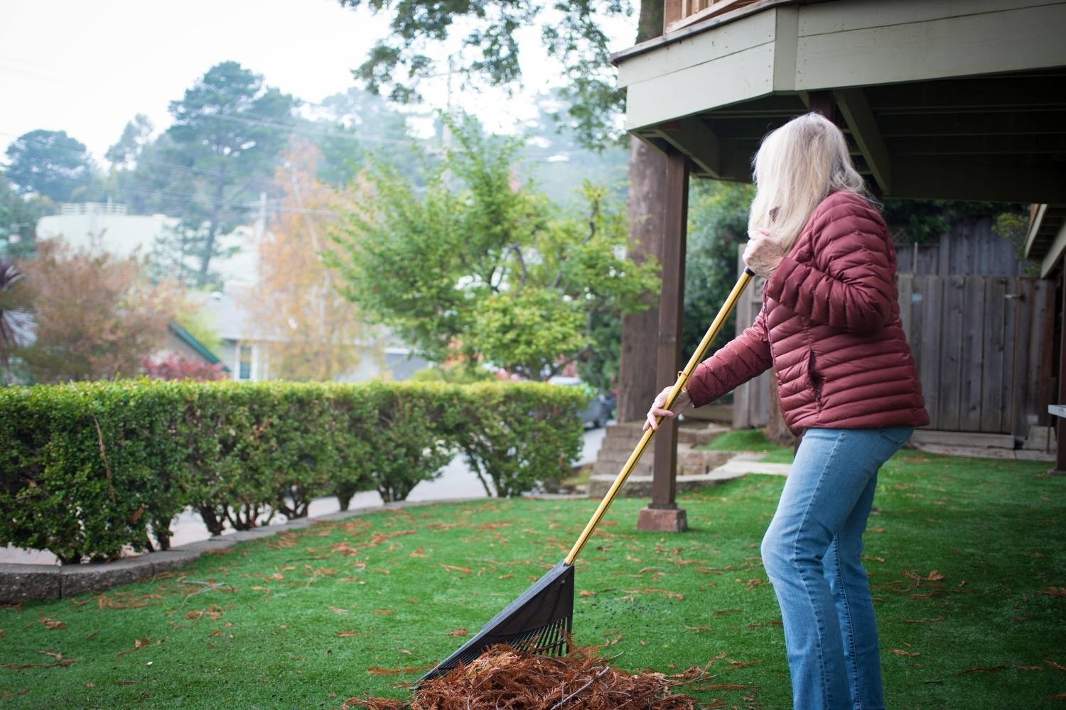 Donna Erickson rakes leaves alone in her yard, a quiet moment that reflects the isolation many seniors experience as daily interactions fade. Familiar routines can fill the hours, but often replace the conversations and connections that once defined community life, underscoring the importance of being seen and heard in later years.