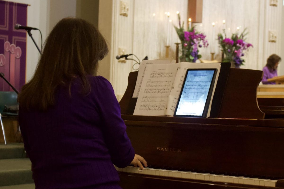 The church musician plays the piano to accompany the worship service. Music is very important during prayer as it enhances prayers by helping individuals focus, express emotions, and receive spiritual insight.